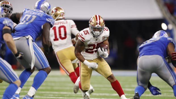Sep 12, 2021; Detroit, Michigan, USA; San Francisco 49ers running back Elijah Mitchell (25) runs with the ball against the Detroit Lions during the fourth quarter at Ford Field. Mandatory Credit: Raj Mehta-USA TODAY Sports